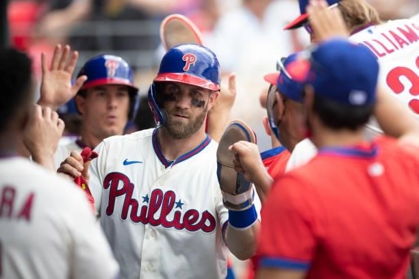 Bryce Harper of the Philadelphia Phillies high fives his teammates against the New York Yankees at Citizens Bank Park on June 13, 2021 in...
