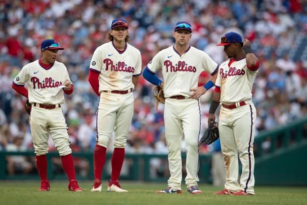Ronald Torreyes, Alec Bohm, Rhys Hoskins, and Jean Segura of the Philadelphia Phillies look on against the New York Yankees at Citizens Bank Park on...