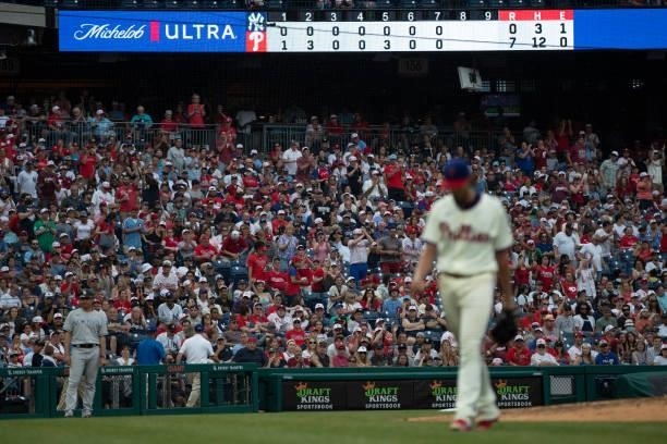 Fans applaud Aaron Nola of the Philadelphia Phillies as he walks to the dugout after being removed from the game in the top of the eighth inning...