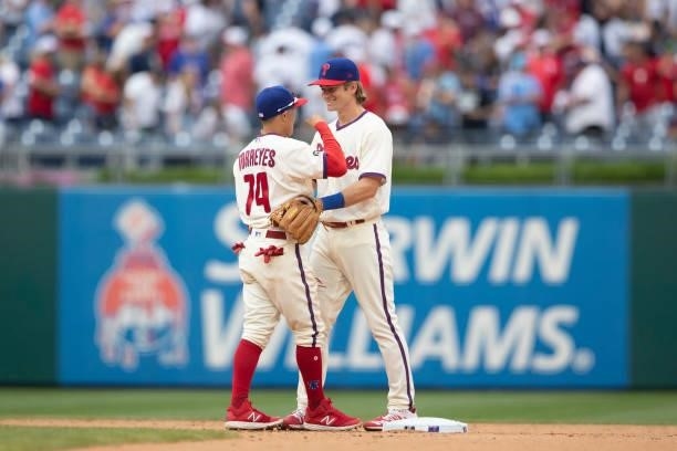 Ronald Torreyes and Luke Williams of the Philadelphia Phillies celebrate their win against the New York Yankees at Citizens Bank Park on June 13,...