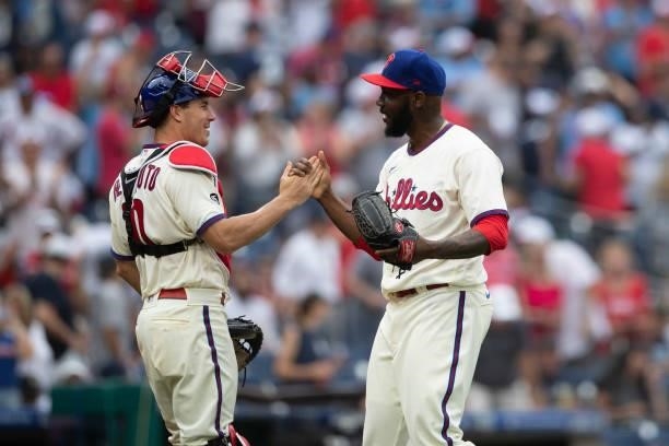 Realmuto and Enyel De Los Santos of the Philadelphia Phillies celebrate their win against the New York Yankees at Citizens Bank Park on June 13, 2021...