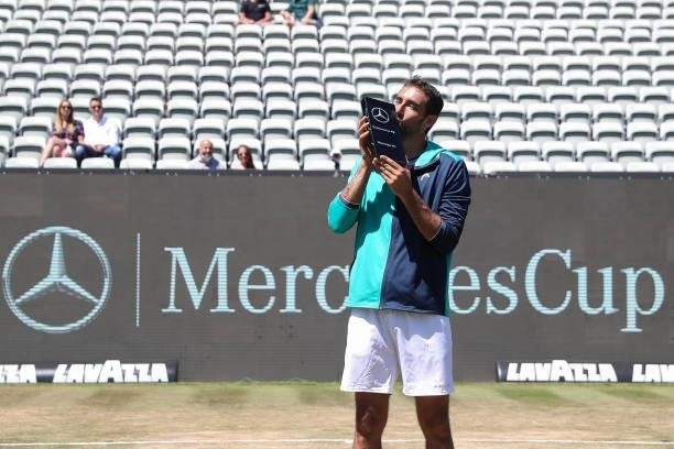 Marin Cilic of Croatia poses with trophy after winning the final match of MercedesCup against Felix Auger-Aliassime of Canada during day 7 of the...