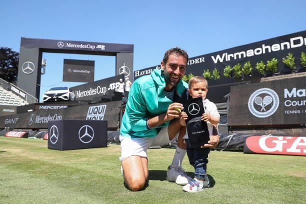 Marin Cilic of Croatia poses with his son and trophy after winning the final match of MercedesCup against Felix Auger-Aliassime of Canada during day...