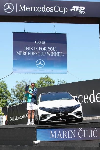 Marin Cilic of Croatia poses with trophy next to Mercedes-Benz winner`s car after Men`s final match during day 7 of the MercedesCup at Tennisclub...