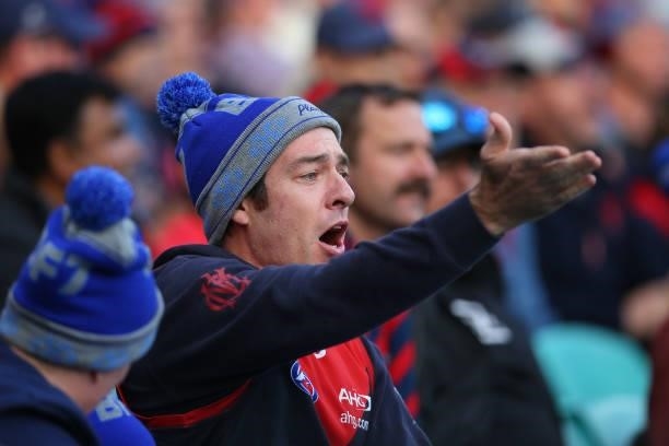 Demons fan gestures during the round 13 AFL match between the Melbourne Demons and the Collingwood Magpies at Sydney Cricket Ground on June 14, 2021...