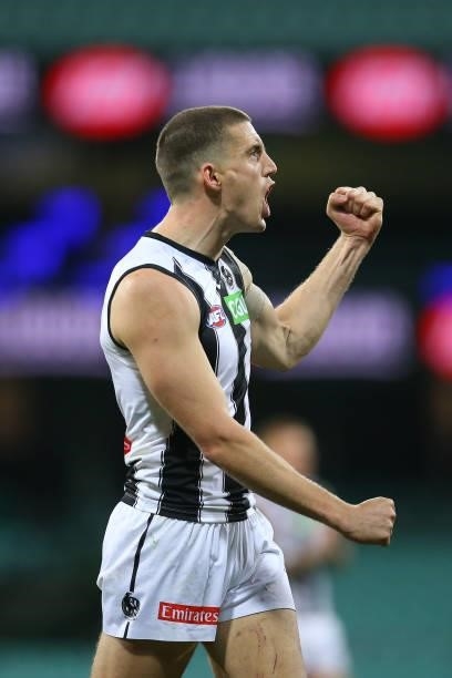 Darcy Cameron of the Magpies celebrates kicking a goal during the round 13 AFL match between the Melbourne Demons and the Collingwood Magpies at...