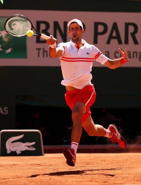 Novak Djokovic of Serbia plays a forehand in his Men's Singles Final match against Stefanos Tsitsipas of Greece during Day Fifteen of the 2021 French...