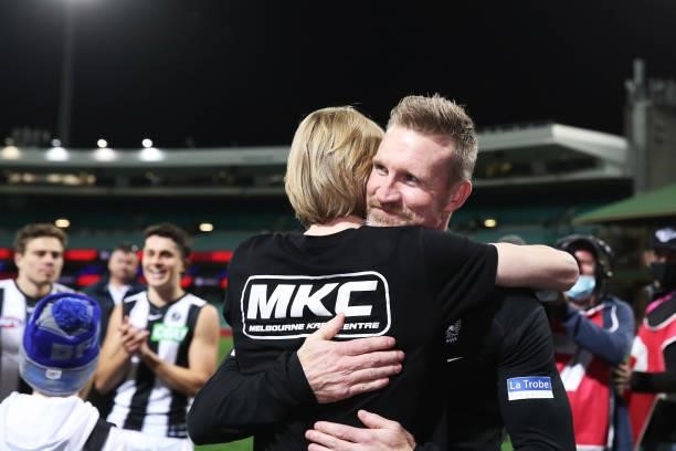 Magpies head coach Nathan Buckley celebrates victory with son Jett Buckley after coaching his final game for the Magpies during the round 13 AFL...