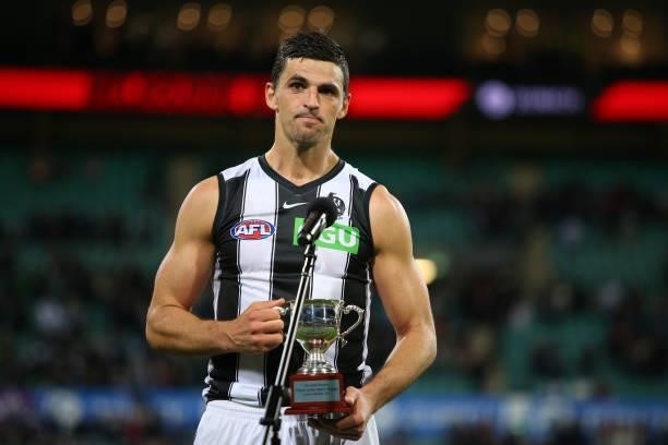 Scott Pendlebury of the Magpies is presented the Neale Daniher Trophy during the round 13 AFL match between the Melbourne Demons and the Collingwood...