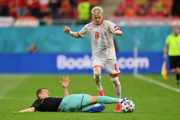 Egzijan Alioski of North Macedonia is challenged by Stefan Lainer of Austria during the UEFA Euro 2020 Championship Group C match between Austria and...