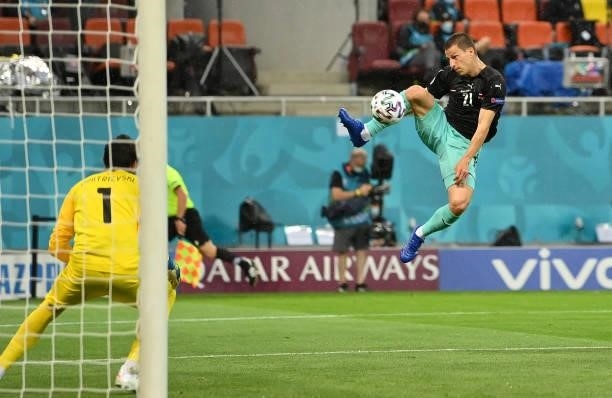 Stefan Lainer of Austria scores his side's first goal past Stole Dimitrievski of North Macedonia during the UEFA Euro 2020 Championship Group C match...