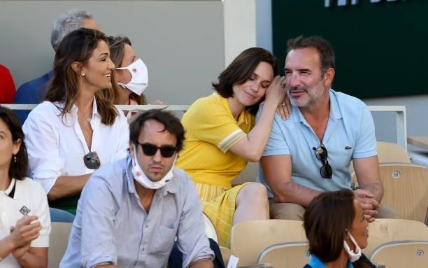 Nadia Fares, Nathalie Pechalat and husband Jean Dujardin attend the Men's Singles Final during day 15 of the 2021 Roland-Garros, French Open, a Grand...