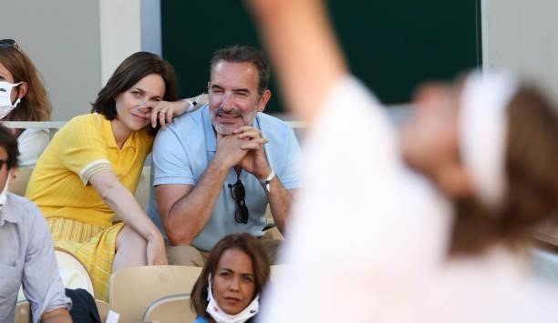 Jean Dujardin and his wife Nathalie Pechalat watching Stefanos Tsitsipas of Greece during the Men's Singles Final during day 15 of the 2021...