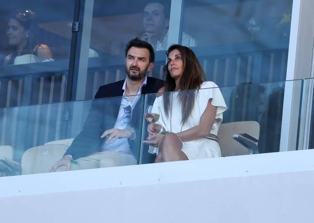 Cyril Lignac and his girlfriend attend the Men's Singles Final during day 15 of the 2021 Roland-Garros, French Open, a Grand Slam tennis tournament...