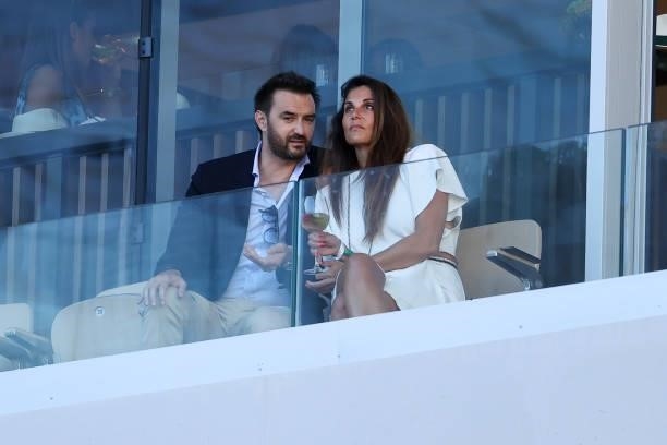 Cyril Lignac and his girlfriend attend the Men's Singles Final during day 15 of the 2021 Roland-Garros, French Open, a Grand Slam tennis tournament...