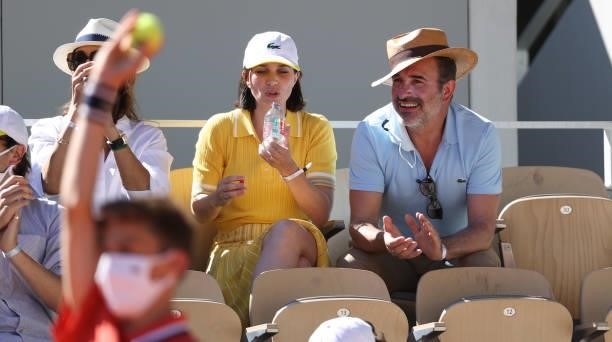 Jean Dujardin and his wife Nathalie Pechalat attend the Men's Singles Final during day 15 of the 2021 Roland-Garros, French Open, a Grand Slam tennis...