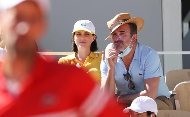 Jean Dujardin and his wife Nathalie Pechalat watching Novak Djokovic during the Men's Singles Final during day 15 of the 2021 Roland-Garros, French...