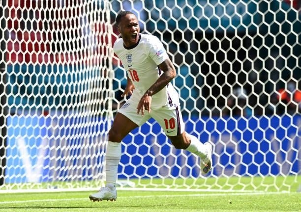 Raheem Sterling of England celebrates after scoring their side's first goal during the UEFA Euro 2020 Championship Group D match between England and...