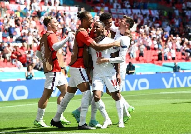 Raheem Sterling of England celebrates with team mates after scoring their side's first goal during the UEFA Euro 2020 Championship Group D match...