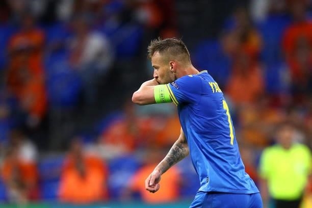 Andriy Yarmolenko of Ukraine kisses his arm as he celebrates scoring their first goal during the UEFA Euro 2020 Championship Group C match between...