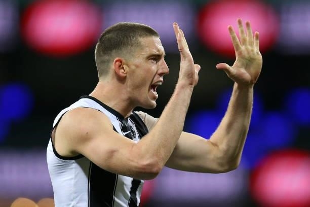Darcy Cameron of the Magpies celebrates kicking a goal during the round 13 AFL match between the Melbourne Demons and the Collingwood Magpies at...