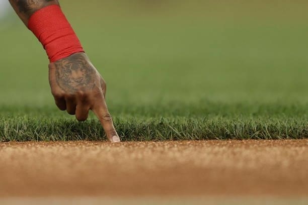 Starlin Castro of the Washington Nationals writes in the infield dirt with his finger before playing against the San Francisco Giants at Nationals...