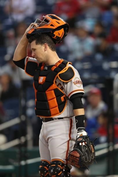Buster Posey of the San Francisco Giants looks on against the Washington Nationals at Nationals Park on June 11, 2021 in Washington, DC.