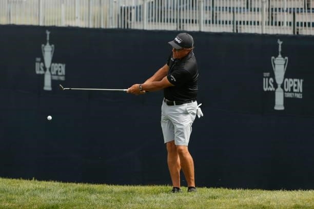 Phil Mickelson of the United States chips to the 13th green during a practice round prior to the start of the 2021 U.S. Open at Torrey Pines Golf...