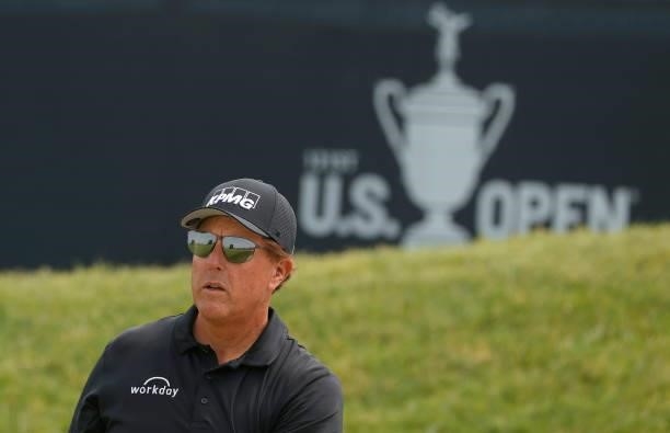 Phil Mickelson of the United States watches a shot from a bunker on the 13th hole during a practice round prior to the start of the 2021 U.S. Open at...
