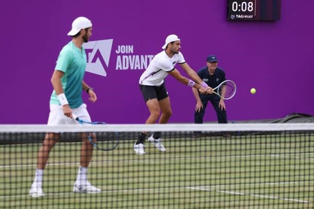 Matteo Berrettini of Italy, playing partner of Andrea Vavassori of Italy plays a backhand in their First Round Doubles match against Cameron Norrie...