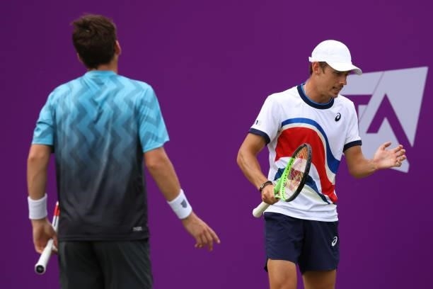 Alex de Minaur of Australia, playing partner of Cameron Norrie of Great Britain reacts in their First Round Doubles match against Andrea Vavassori...