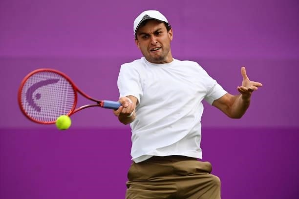 Aslan Karatsev of Russia plays a forehand in his First Round match against Alejandro Tabilo of Chile during Day 1 of the cinch Championships at The...