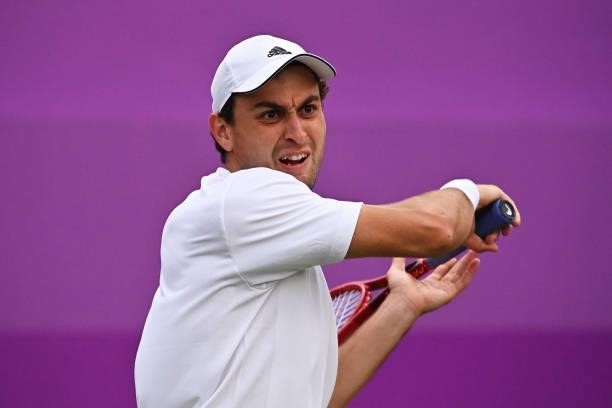Aslan Karatsev of Russia plays a forehand in his First Round match against Alejandro Tabilo of Chile during Day 1 of the cinch Championships at The...