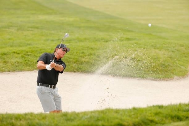 Phil Mickelson of the United States plays a shot from a bunker on the 15th hole during a practice round prior to the start of the 2021 U.S. Open at...