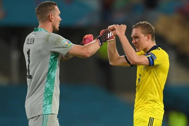 Robin Olsen and Ludwig Augustinsson of Sweden celebrate following the UEFA Euro 2020 Championship Group E match between Spain and Sweden at the La...