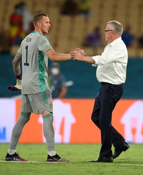 Jan Andersson, Head Coach of Sweden shakes hands with Robin Olsen of Sweden following the UEFA Euro 2020 Championship Group E match between Spain and...