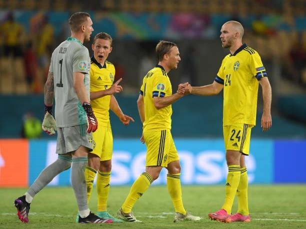 Andreas Granqvist of Sweden interacts with team mate Marcus Danielson after the UEFA Euro 2020 Championship Group E match between Spain and Sweden at...