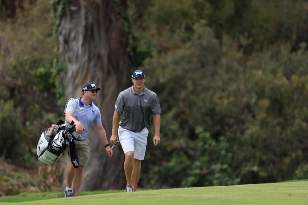 Kyle Westmoreland of the United States and caddie walk the 12th hole during a practice round prior to the start of the 2021 U.S. Open at Torrey Pines...