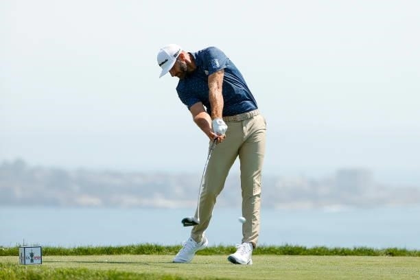Dustin Johnson of the United States plays his shot from the fourth tee during a practice round prior to the start of the 2021 U.S. Open at Torrey...