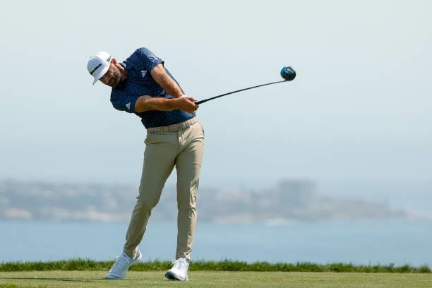 Dustin Johnson of the United States plays his shot from the fourth tee during a practice round prior to the start of the 2021 U.S. Open at Torrey...