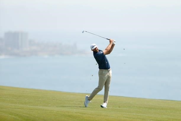 Dustin Johnson of the United States plays a shot on the fourth hole during a practice round prior to the start of the 2021 U.S. Open at Torrey Pines...