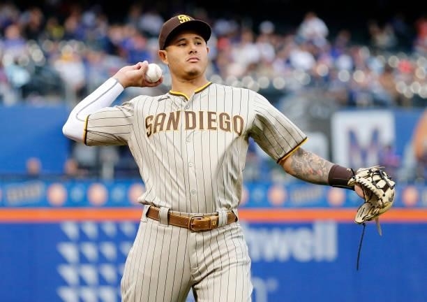 Manny Machado of the San Diego Padres warms up on the field before a game against the New York Mets at Citi Field on June 11, 2021 in New York City....
