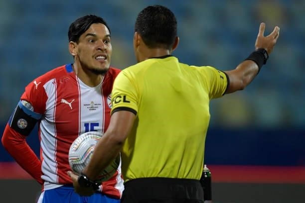 Gustavo Gomez of Paraguay argues with referee Diego Mirko Haro during a Group A match between Paraguay and Bolivia at Estádio Olímpico as part of...
