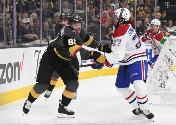 Alexander Romanov of the Montreal Canadiens battles Jonathan Marchessault of the Vegas Golden Knights during the first period in Game One of the...