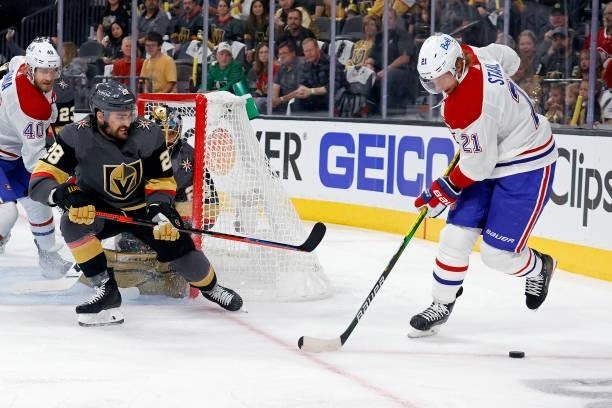 William Carrier of the Vegas Golden Knights defends Eric Staal of the Montreal Canadiens during the first period in Game One of the Stanley Cup...