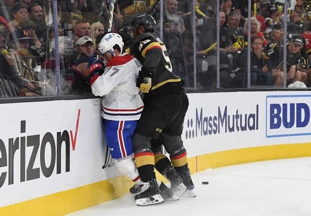 Keegan Kolesar of the Vegas Golden Knights hits Brett Kulak of the Montreal Canadiens during the first period in Game One of the Stanley Cup...