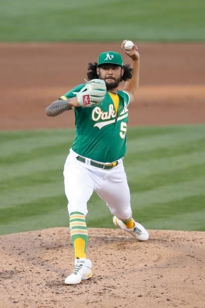 Sean Manaea of the Oakland Athletics pitches in the top of the second inning against the Los Angeles Angels at RingCentral Coliseum on June 14, 2021...
