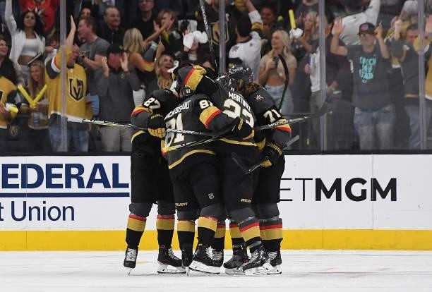 Alec Martinez of the Vegas Golden Knights celebrates with teammates after scoring a goal during the first period against the Montreal Canadiens in...