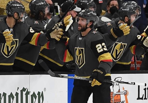 Alec Martinez of the Vegas Golden Knights celebrates with teammates after scoring a goal during the first period against the Montreal Canadiens in...