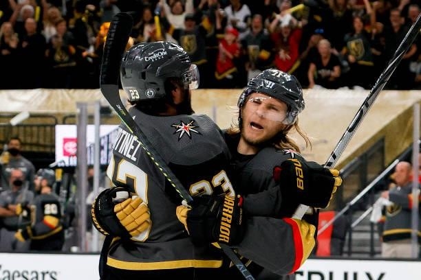Alec Martinez of the Vegas Golden Knights is congratulated by William Karlsson after scoring a goal against the Montreal Canadiens during the second...